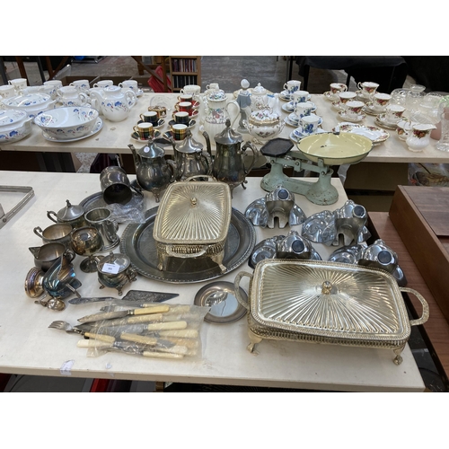 305 - A collection of metalware to include four Victorian style chrome plated bath feet, three silver plat... 