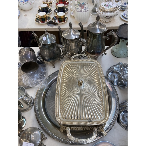 305 - A collection of metalware to include four Victorian style chrome plated bath feet, three silver plat... 