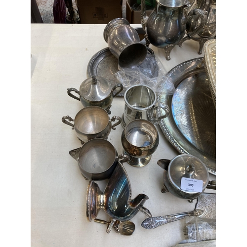 305 - A collection of metalware to include four Victorian style chrome plated bath feet, three silver plat... 