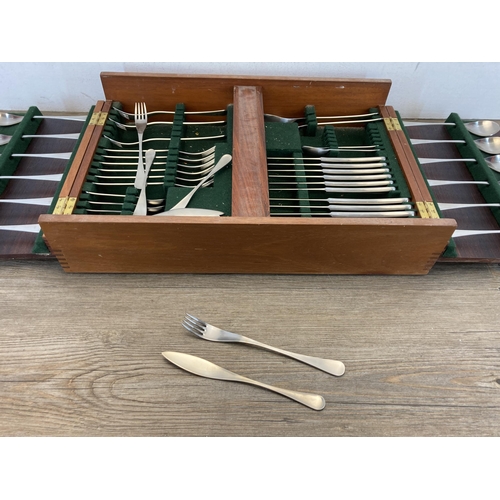 306 - A mid 20th century Old Hall wooden cased canteen of stainless steel cutlery