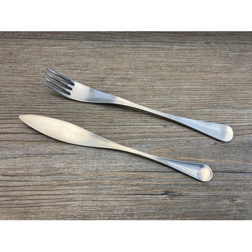 306 - A mid 20th century Old Hall wooden cased canteen of stainless steel cutlery