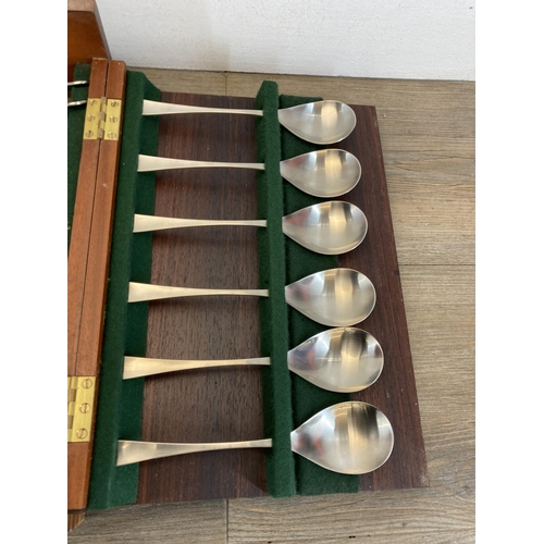 306 - A mid 20th century Old Hall wooden cased canteen of stainless steel cutlery