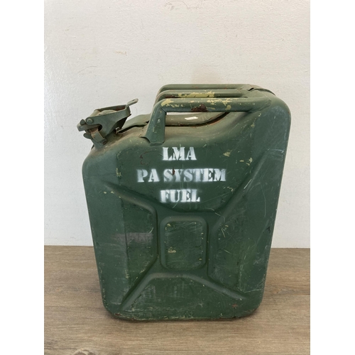 308 - A mid 20th century green painted metal jerry can - approx. 47cm high