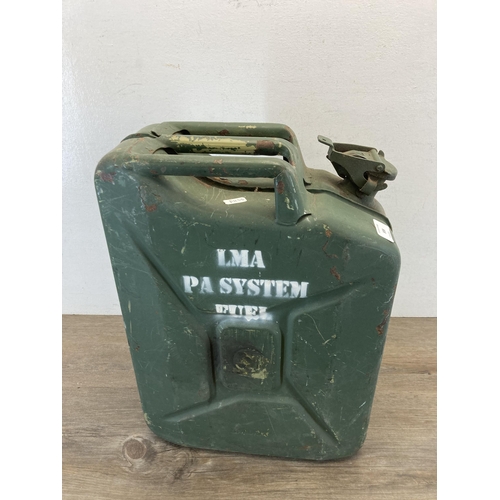 308 - A mid 20th century green painted metal jerry can - approx. 47cm high