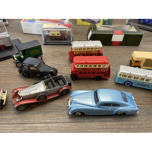 313 - A collection of boxed and unboxed diecast model vehicles to include Atlas Editions Aston Martin DB5,... 