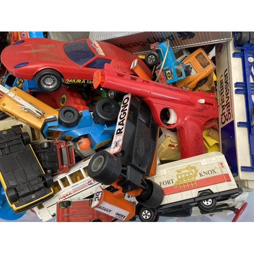 314 - A collection of toys to include 1980s New Bright Morgan TR2 talking robot, Lone Star cap gun, diecas... 