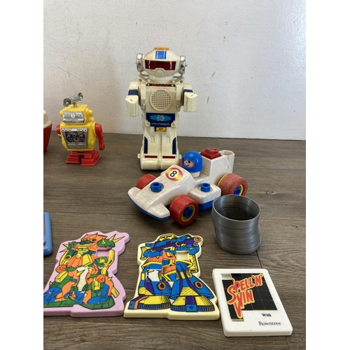 314 - A collection of toys to include 1980s New Bright Morgan TR2 talking robot, Lone Star cap gun, diecas... 