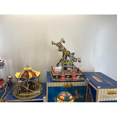 317 - Six boxed Lemax Village Collection display models to include The Cosmic Swing, Le Zinger, Belmont Ca... 