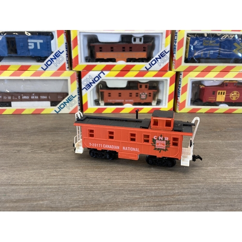 326 - Seven boxed Lionel HO electric train accessories to include T-20102 box car, T-20171 caboose, T-0105... 