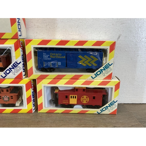 326 - Seven boxed Lionel HO electric train accessories to include T-20102 box car, T-20171 caboose, T-0105... 