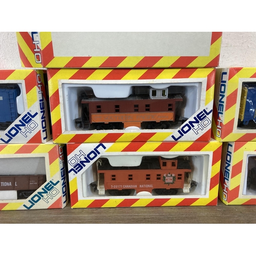 326 - Seven boxed Lionel HO electric train accessories to include T-20102 box car, T-20171 caboose, T-0105... 