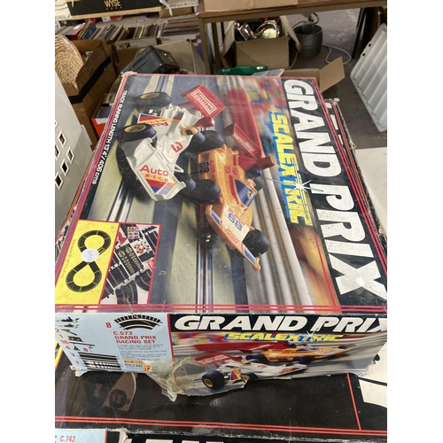 335 - Three boxed Scalextric sets, one Le Man 24hr, one Grand Prix and one accessory set