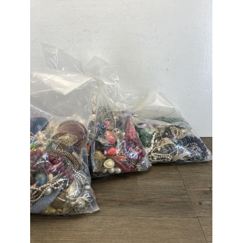 385 - Five bags containing costume jewellery