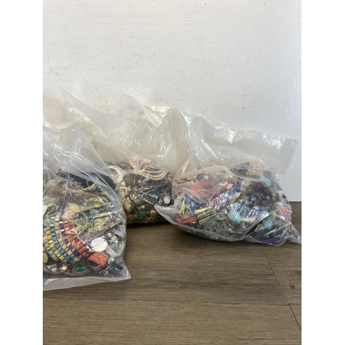 387 - Five bags containing costume jewellery