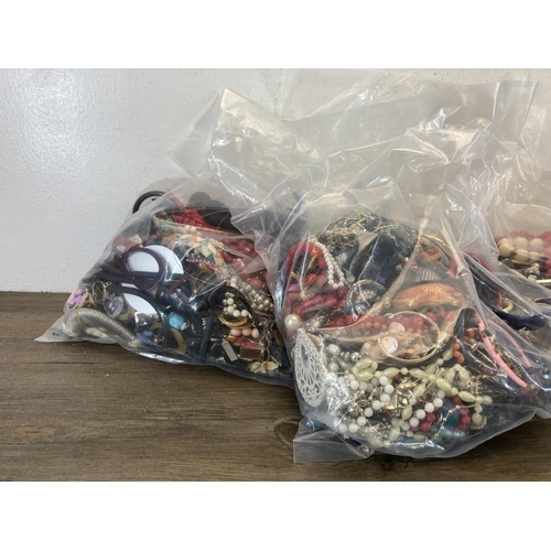 390 - Five bags containing costume jewellery