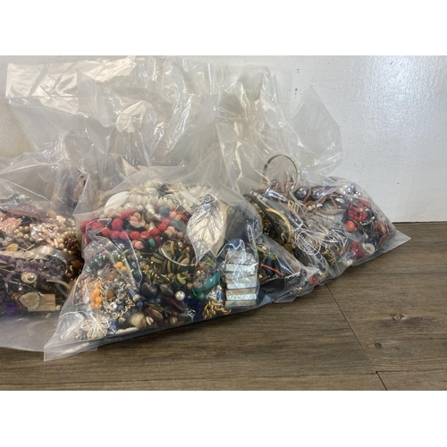 395 - Five bags containing costume jewellery