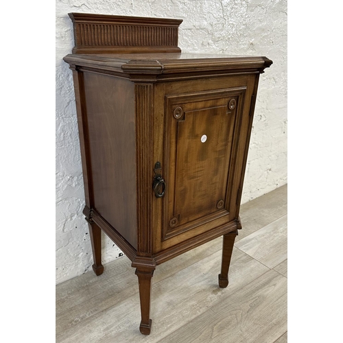 1 - An Edwardian mahogany bedside cabinet on tapering supports - approx. 87cm high x 44cm wide x 41cm de... 