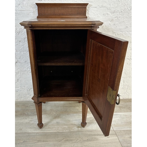 1 - An Edwardian mahogany bedside cabinet on tapering supports - approx. 87cm high x 44cm wide x 41cm de... 