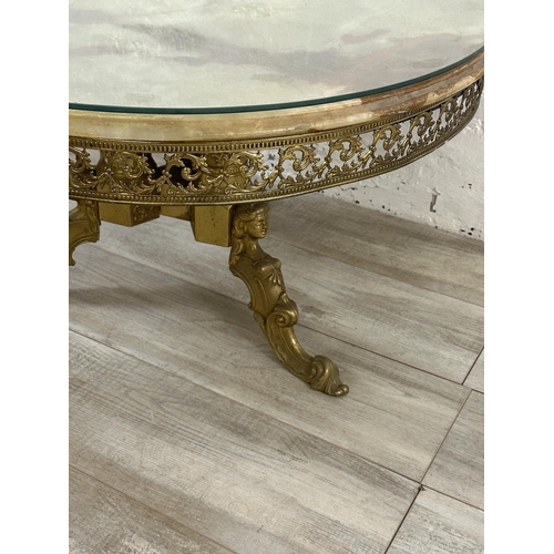 13 - A Rococo style onyx and gilt metal circular tripod pedestal coffee table with glass top - approx. 46... 