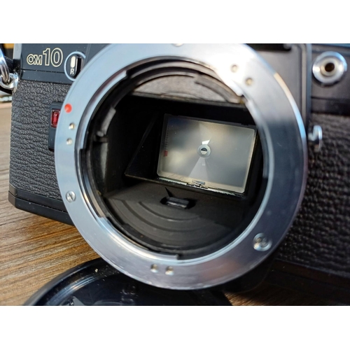 58 - Six boxed Olympus OM system items, one black OM10 35mm SLR body, one Zuiko MC Auto-S 1:1.8 f=50mm le... 