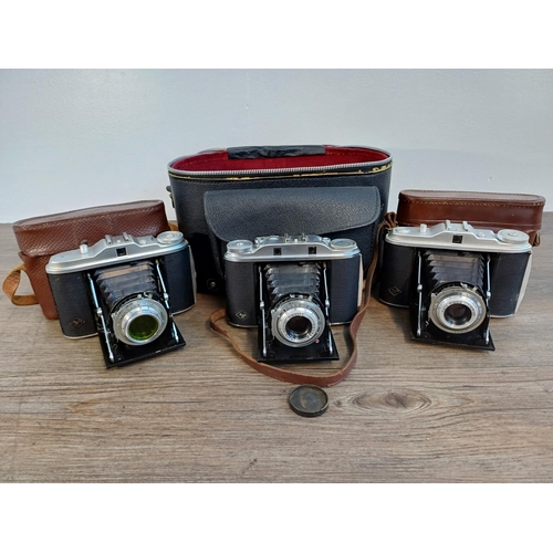 61 - A camera case containing 1950s Agfa Isolette III uncoupled rangefinder folding camera for 6x6 images... 