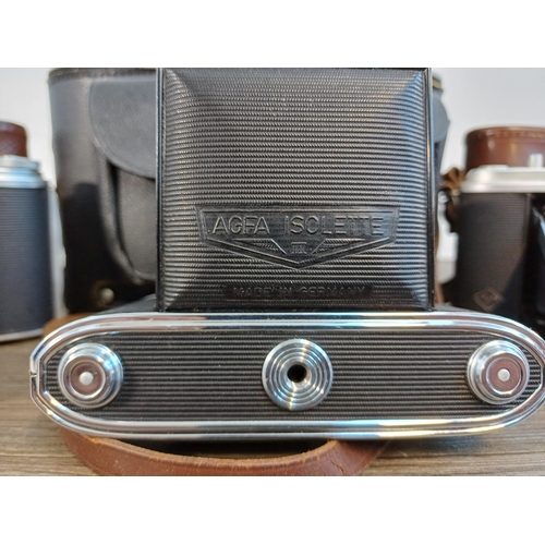 61 - A camera case containing 1950s Agfa Isolette III uncoupled rangefinder folding camera for 6x6 images... 