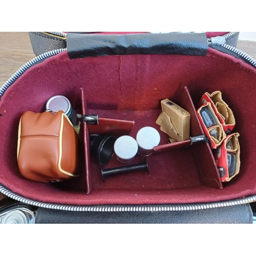 61 - A camera case containing 1950s Agfa Isolette III uncoupled rangefinder folding camera for 6x6 images... 