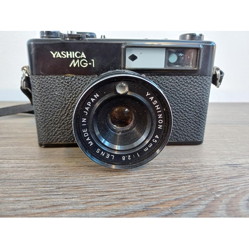 62 - A cased Yashica MG-1 35mm rangefinder camera fitted with Yashinon 1:2.8 45mm lens and Copal shutter