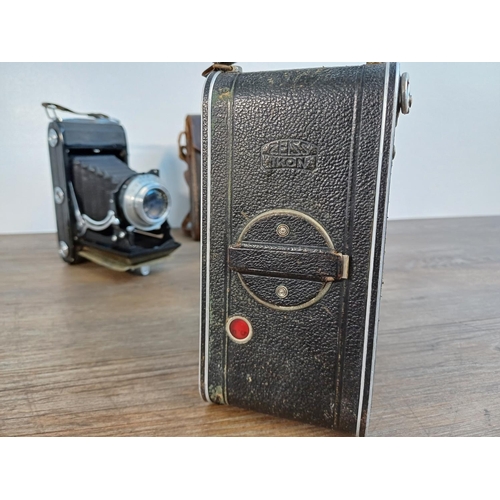 63 - Two Zeiss Ikon folding viewfinder cameras, one cased Cocarette 522/17 for 8x10.5cm images on 122 fil... 