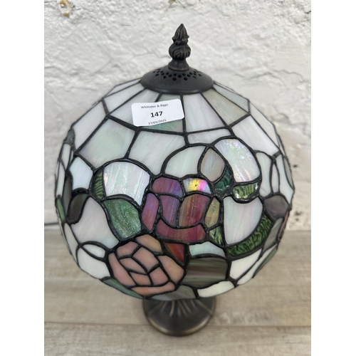 147 - A Tiffany style stained glass and bronzed effect table lamp - approx. 40cm high