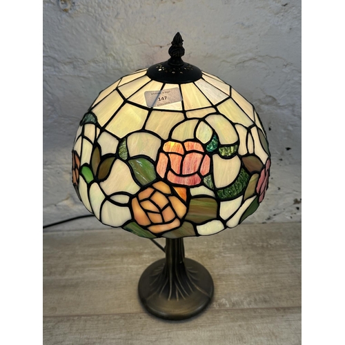 147 - A Tiffany style stained glass and bronzed effect table lamp - approx. 40cm high