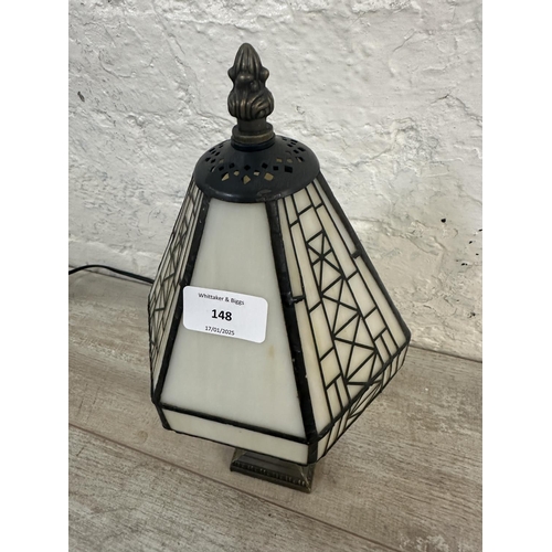 148 - A Tiffany style stained glass and bronzed effect table lamp - approx. 33cm high