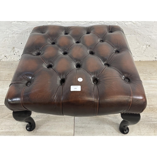 149 - A brown leather Chesterfield footstool on cabriole supports - approx. 34cm high x 56cm wide x 56cm d... 