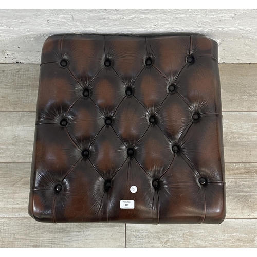 149 - A brown leather Chesterfield footstool on cabriole supports - approx. 34cm high x 56cm wide x 56cm d... 