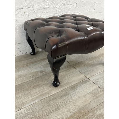 149 - A brown leather Chesterfield footstool on cabriole supports - approx. 34cm high x 56cm wide x 56cm d... 