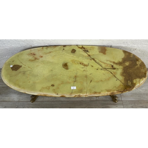 15 - A Rococo style onyx and gilt metal oval twin pedestal coffee table - approx. 45cm high x 50cm wide x... 