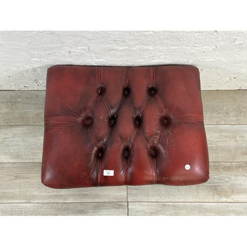 150 - An oxblood leather Chesterfield footstool on cabriole supports - approx. 32cm high x 64cm wide x 49c... 