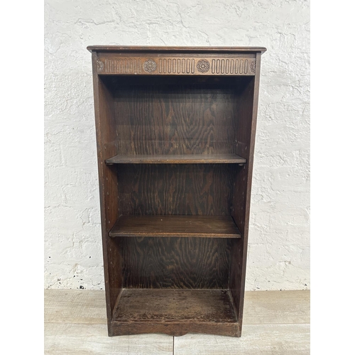 151 - A mid 20th century carved oak three tier bookcase - approx. 102cm high x 50cm wide x 20cm deep