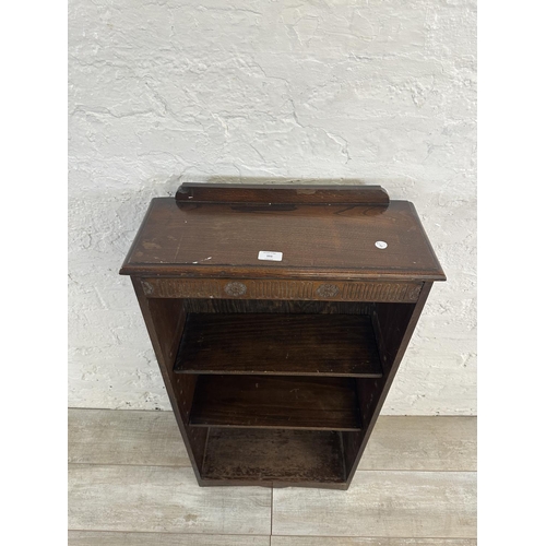 151 - A mid 20th century carved oak three tier bookcase - approx. 102cm high x 50cm wide x 20cm deep