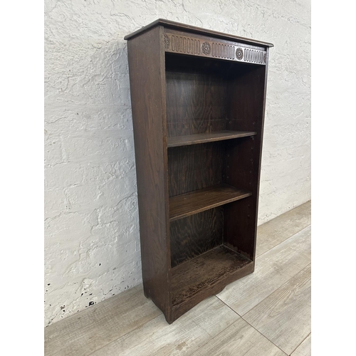 151 - A mid 20th century carved oak three tier bookcase - approx. 102cm high x 50cm wide x 20cm deep