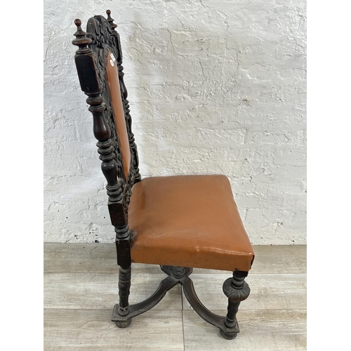 153 - A 19th century carved oak and tan vinyl upholstered dining chair