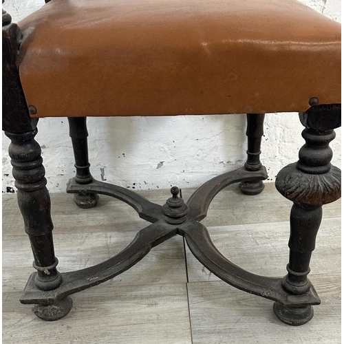 153 - A 19th century carved oak and tan vinyl upholstered dining chair