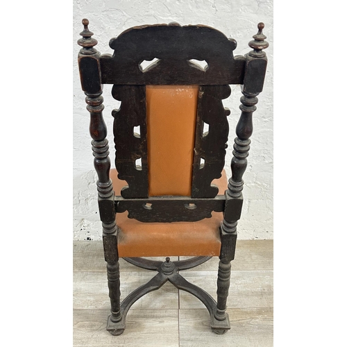 153 - A 19th century carved oak and tan vinyl upholstered dining chair