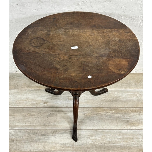 156 - A George III oak circular tilt top tripod pedestal occasional table - approx. 70cm high x 74cm diame... 