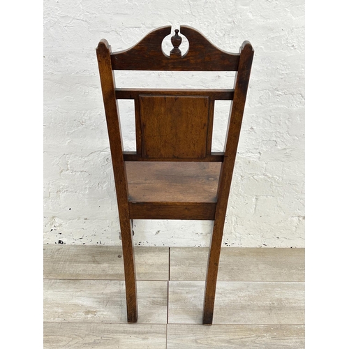 160 - A 19th century oak hall chair with ceramic tile insert