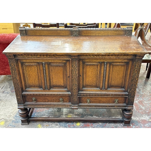 161 - An early 20th century carved oak sideboard - approx. 107cm high x 137cm wide x 53cm deep