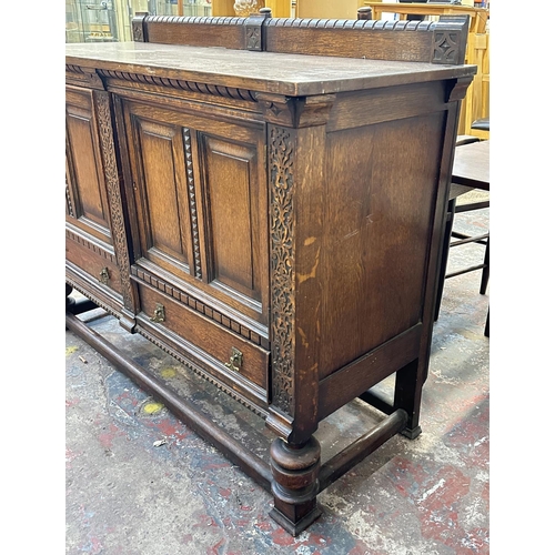 161 - An early 20th century carved oak sideboard - approx. 107cm high x 137cm wide x 53cm deep