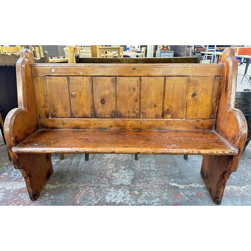 163 - A Victorian pitch pine church pew - approx. 101cm high x 137cm wide x 45cm deep