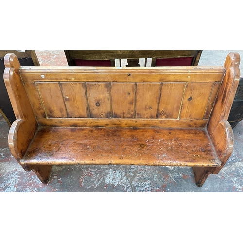 163 - A Victorian pitch pine church pew - approx. 101cm high x 137cm wide x 45cm deep