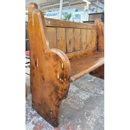 163 - A Victorian pitch pine church pew - approx. 101cm high x 137cm wide x 45cm deep